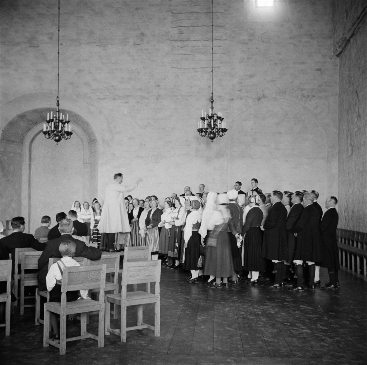 Siljanskören uppträder i Rikssalen på Uppsala slott, april 1938