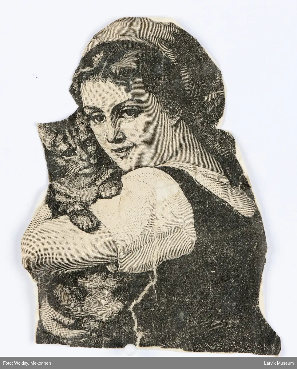 Ung (bonde)jente med en katt i armene