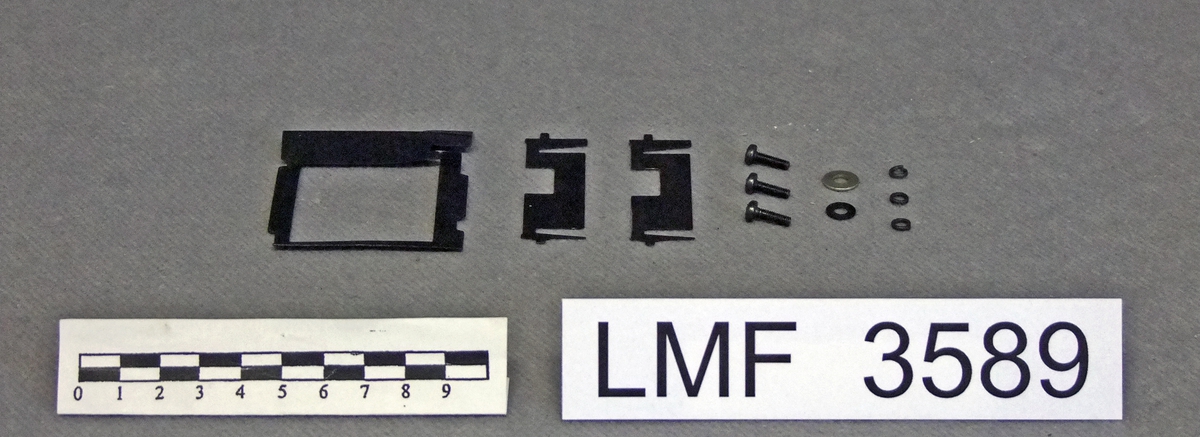 Lysbildeframviser med tilhørende koffert.

Form:  rektangulær grunnform