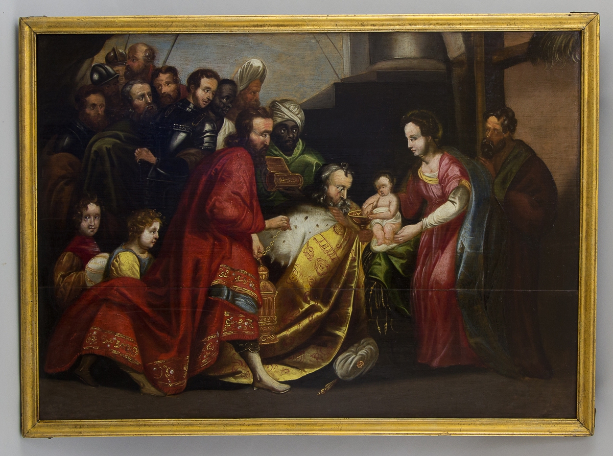 Tavla föreställande de tre vise mänen som lämnar gåvor till Jesusbarnet. Vid sidan står Maria och Josef. I bakgrunden en folksamling med bl.a. soldater.