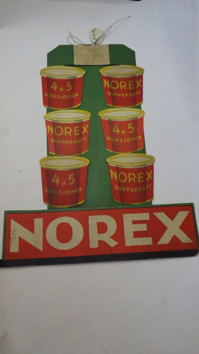 Reklame for Norex produkter: papp. Materiellet har vært stillet opp på disk og hyller.
a ) Hønsebuljong
b) Suppekraft
c ) Fructin fruktstivelse
d) Eddik