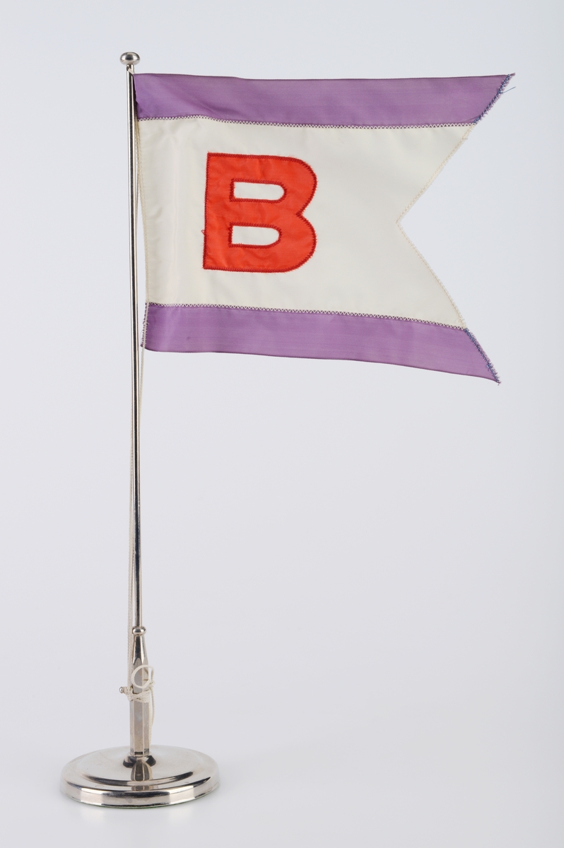 Bordflagg, falmet. Rederiet Arne Blystad, Oslo.