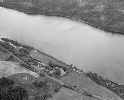 Flyfotografi som viser Glomma og landskapet langs elva på st
