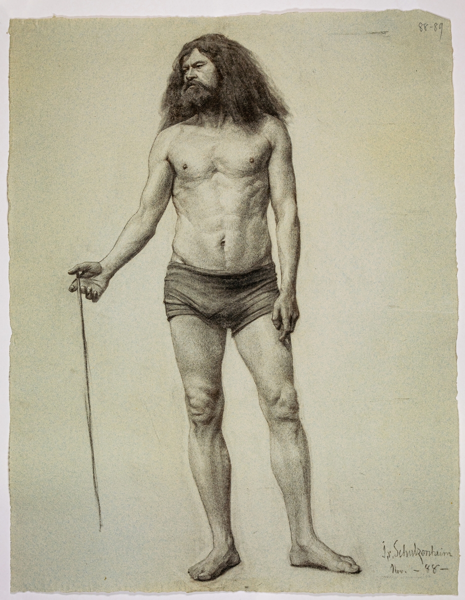 Modellritning/modellstudie, porträtt av stående man, stort skägg och långt hår, muskulös. Hållande pinne i sin högra hand. Signerad I. v. Schulzenheim Nov -88-.