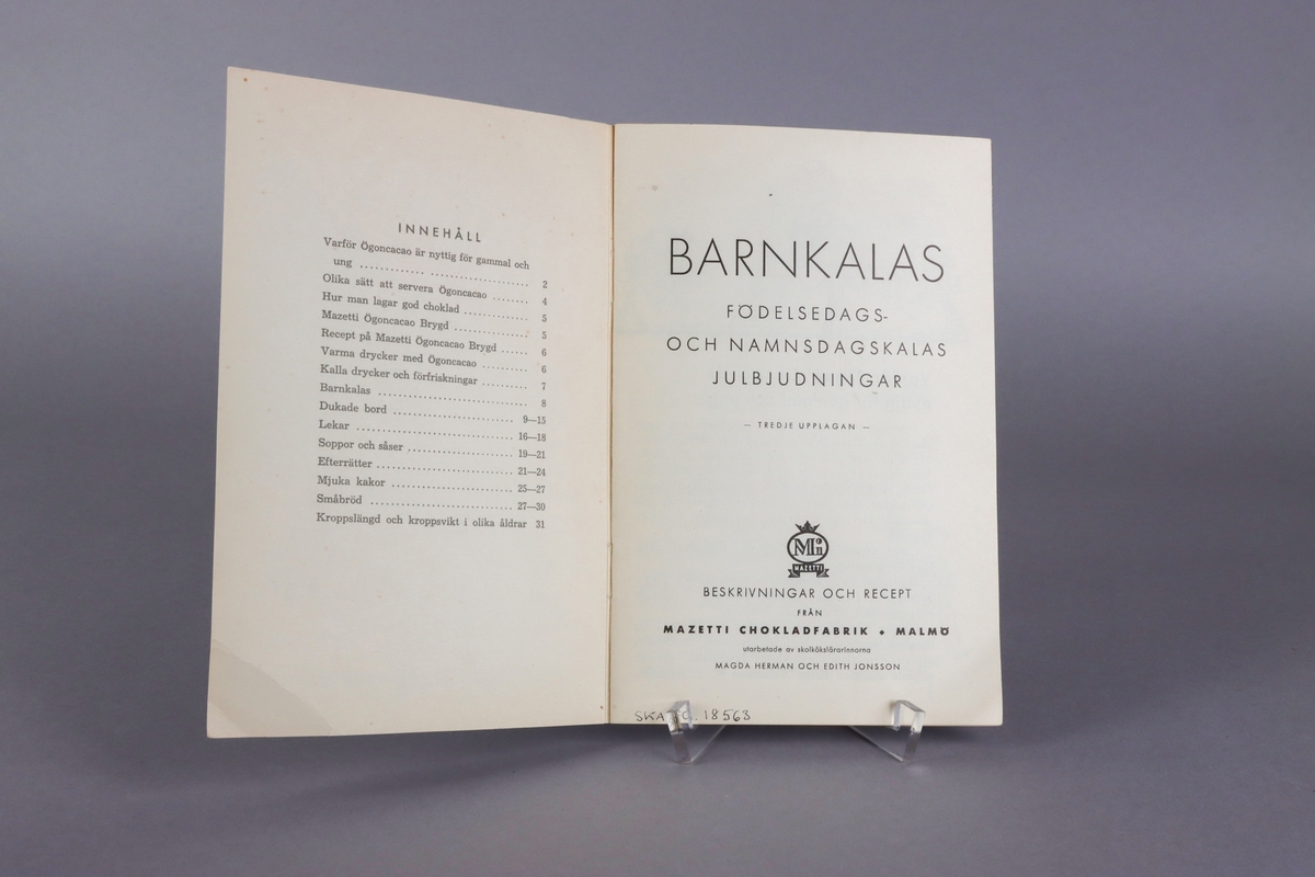 Black and white illustrated promotional booklet titled “ Barnkalas “ issued by Mazetti Chokladfabrik Malmö late 1930´s, 31 pages. Front and back cover with color illustrations. 
The front showing a table set for a birthday party, with two children and the back an advertisement for cocao powder. Inside the booklet a complete list and description, on how to organize a children´s party, how to set the table and what to serve.