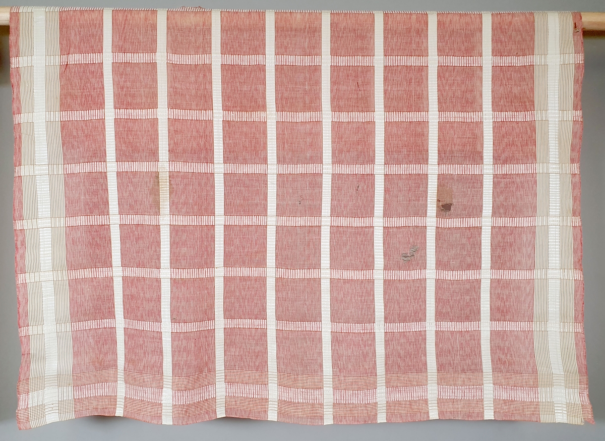 Sjal (tørkle) av silke og bomull, med rutermønster i hvitt og rosa.
