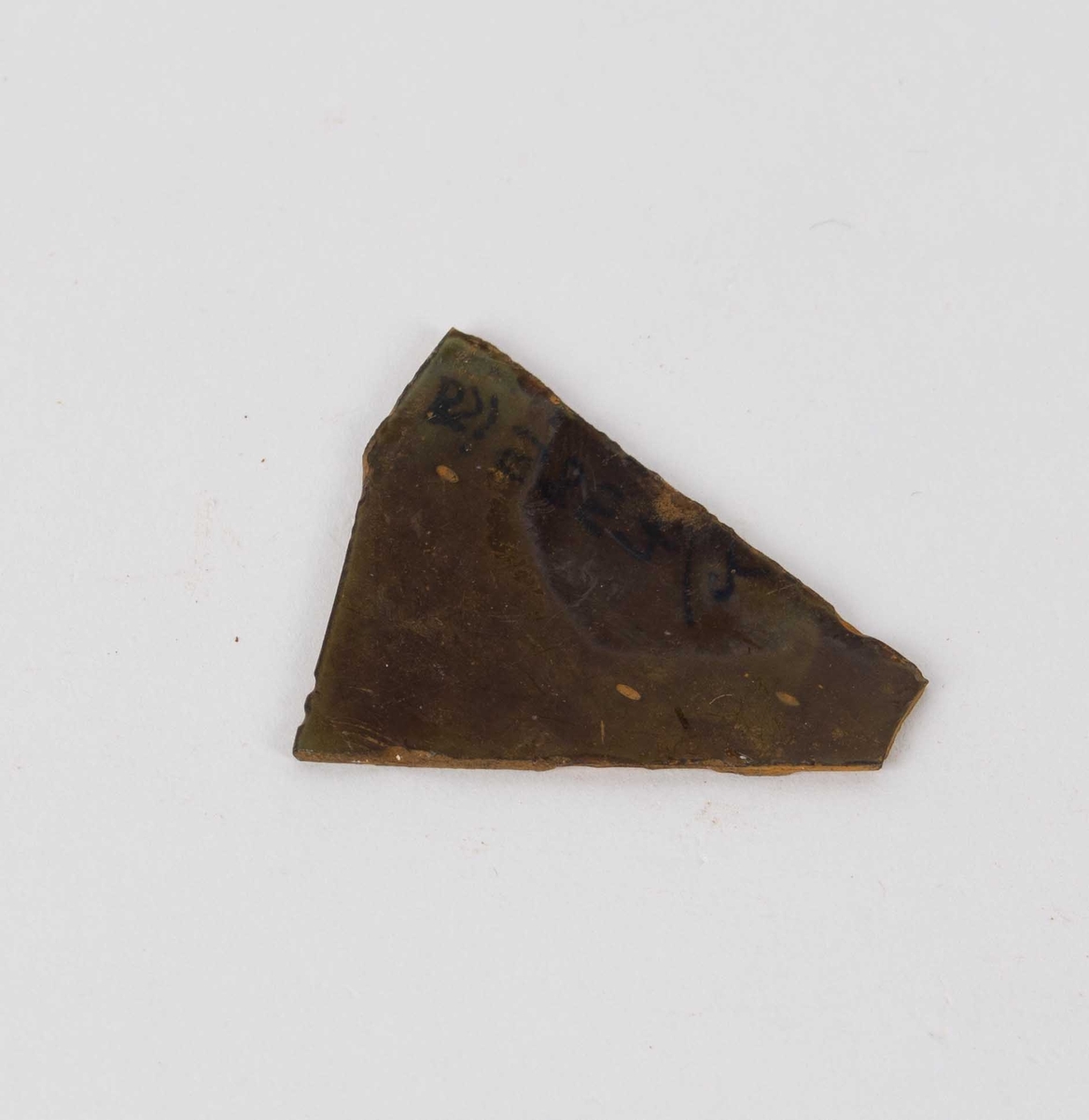 Fragment av grønt glass.
