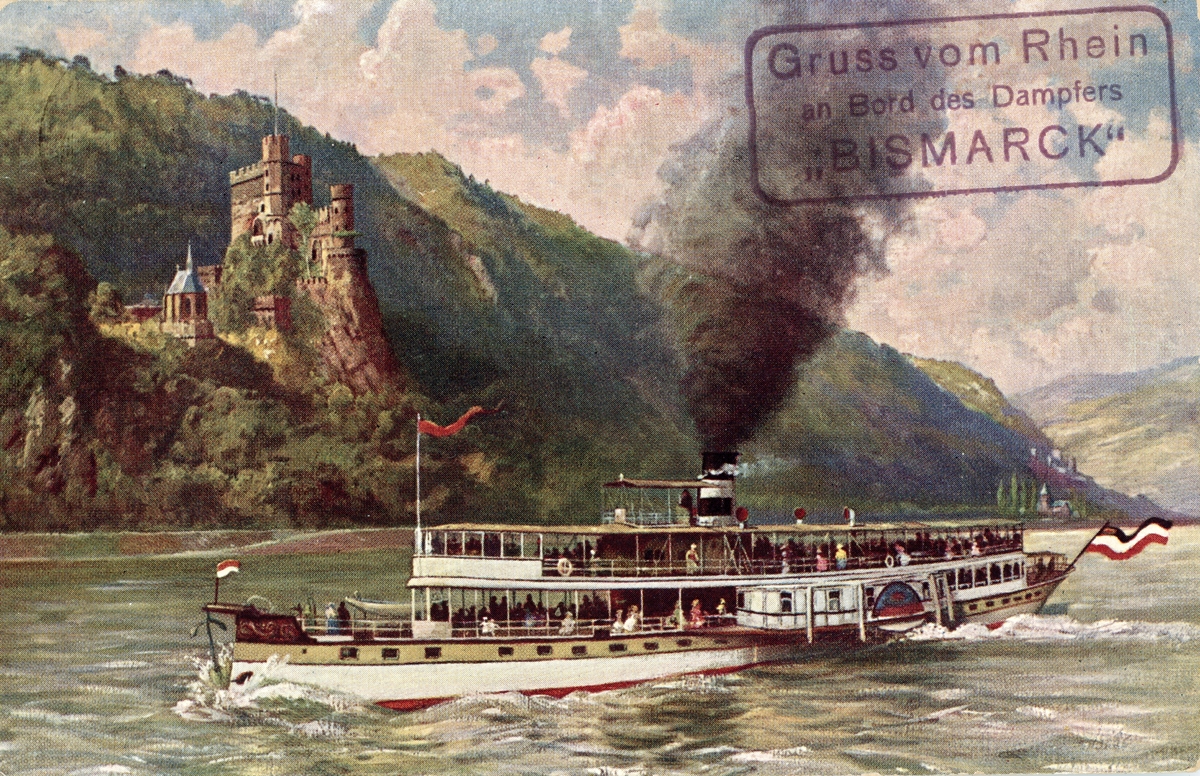 Hjulångare på floden Rhen. I bakgrunden slottet Rheinstein. Vykort, färglitografi efter förlaga av Paul Pützhofen-Hambüchen.