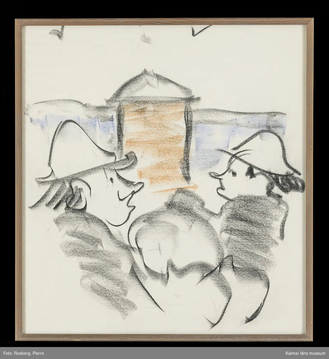 Motivet föreställer två människor framför ett byggnadsverk i svart, blå och brun kulör.