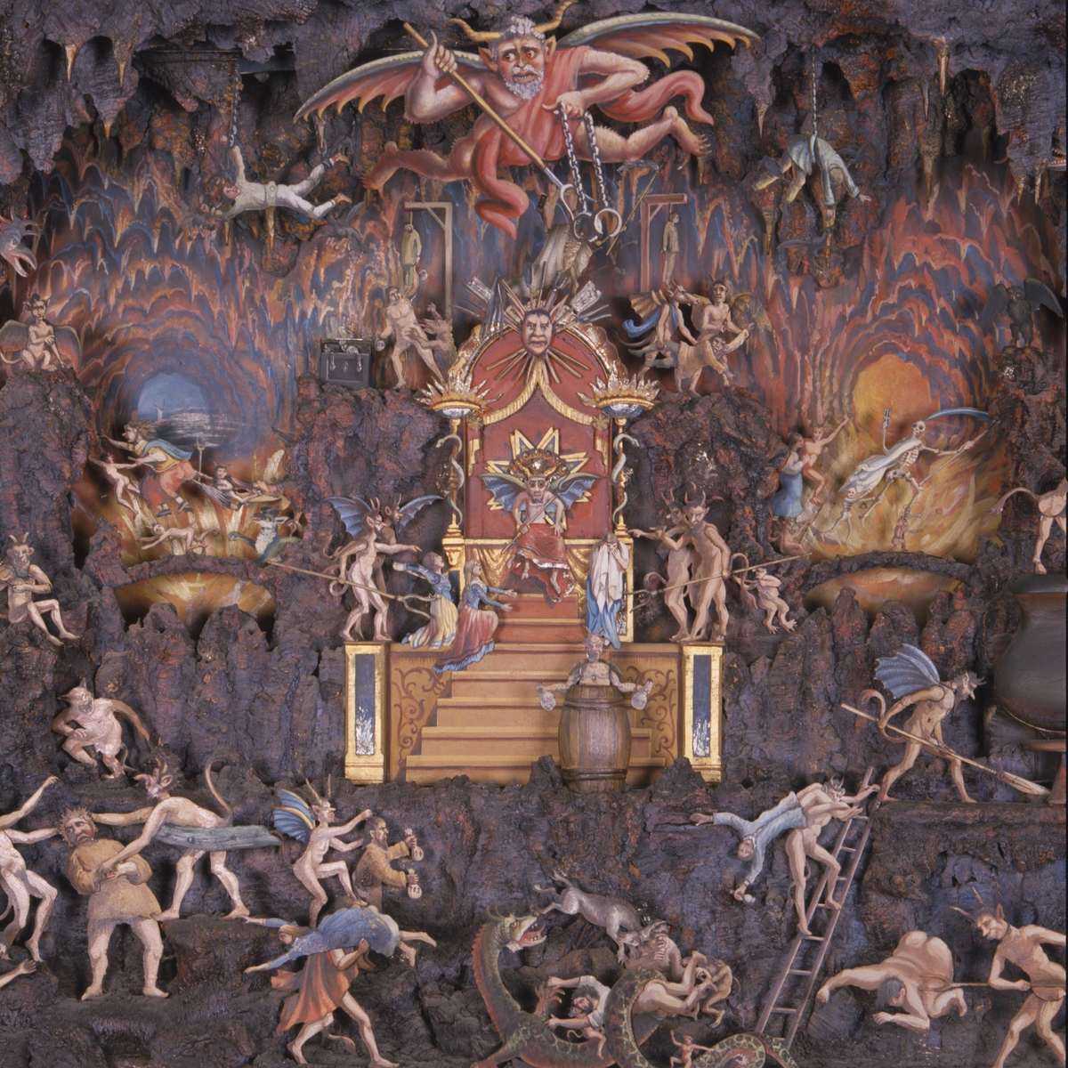 Mekanisk modell. Framställning av helvetet, av trä med rörliga målade figurer av plåt. Använt vid inspelning av filmen "Häxan". 1919-1921.