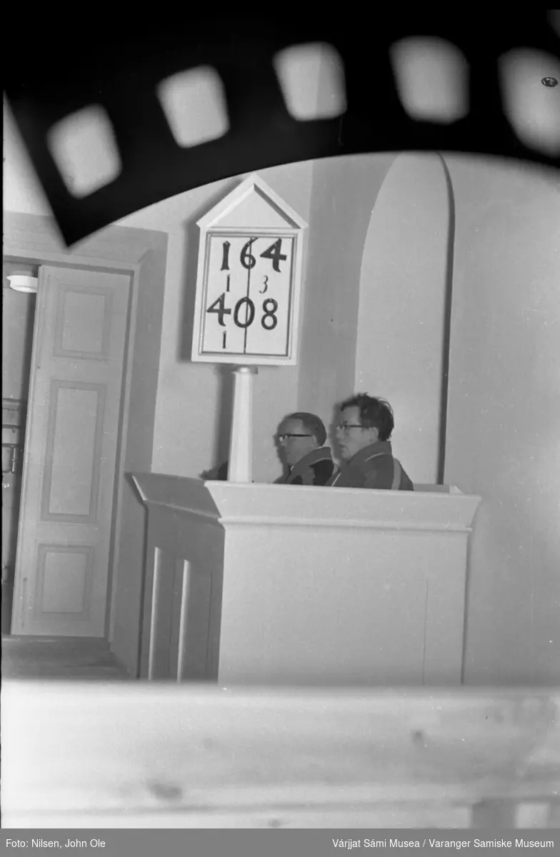 To menn i kofte på en prekestol i en kirke. Ukjent sted høst 1966.