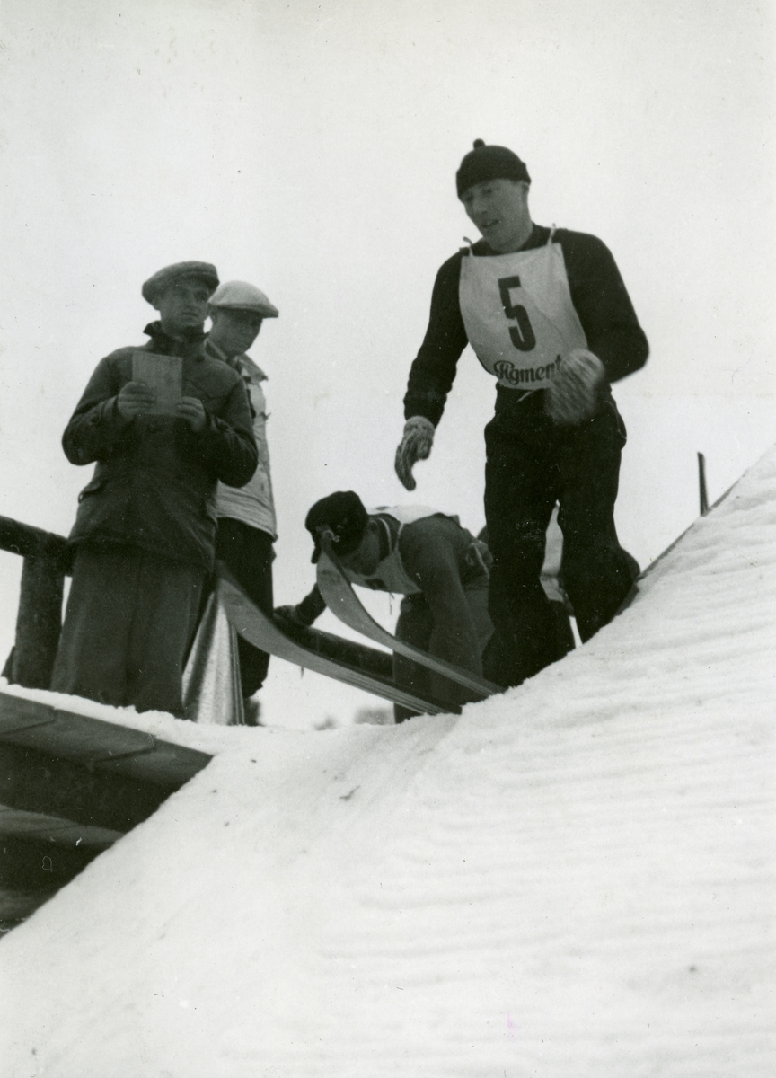 Athlete Reidar Andersen at the top of ski jump at Garmisch