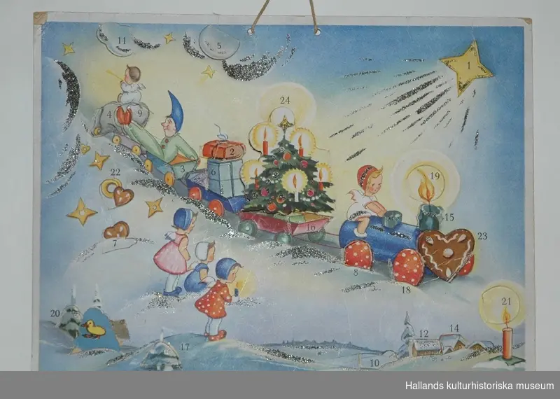 Adventskalender av papper med glitter. Motiv: ett tåg med julgran, julklappar och barn. Märkt på framsidan: "HACO 63."
