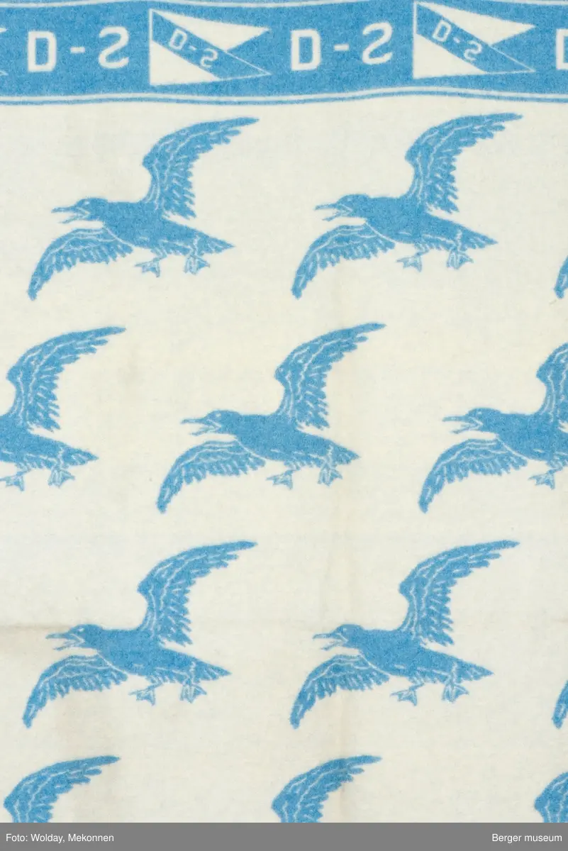 Pledd med måkemotiv