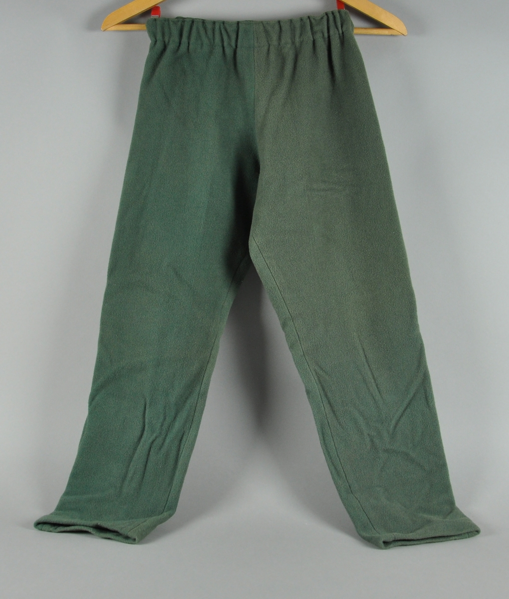 Lang grønn bukse i ull med strikk i livet.