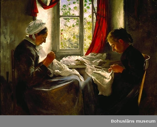 Kvinna och flicka handarbetar vid fönster