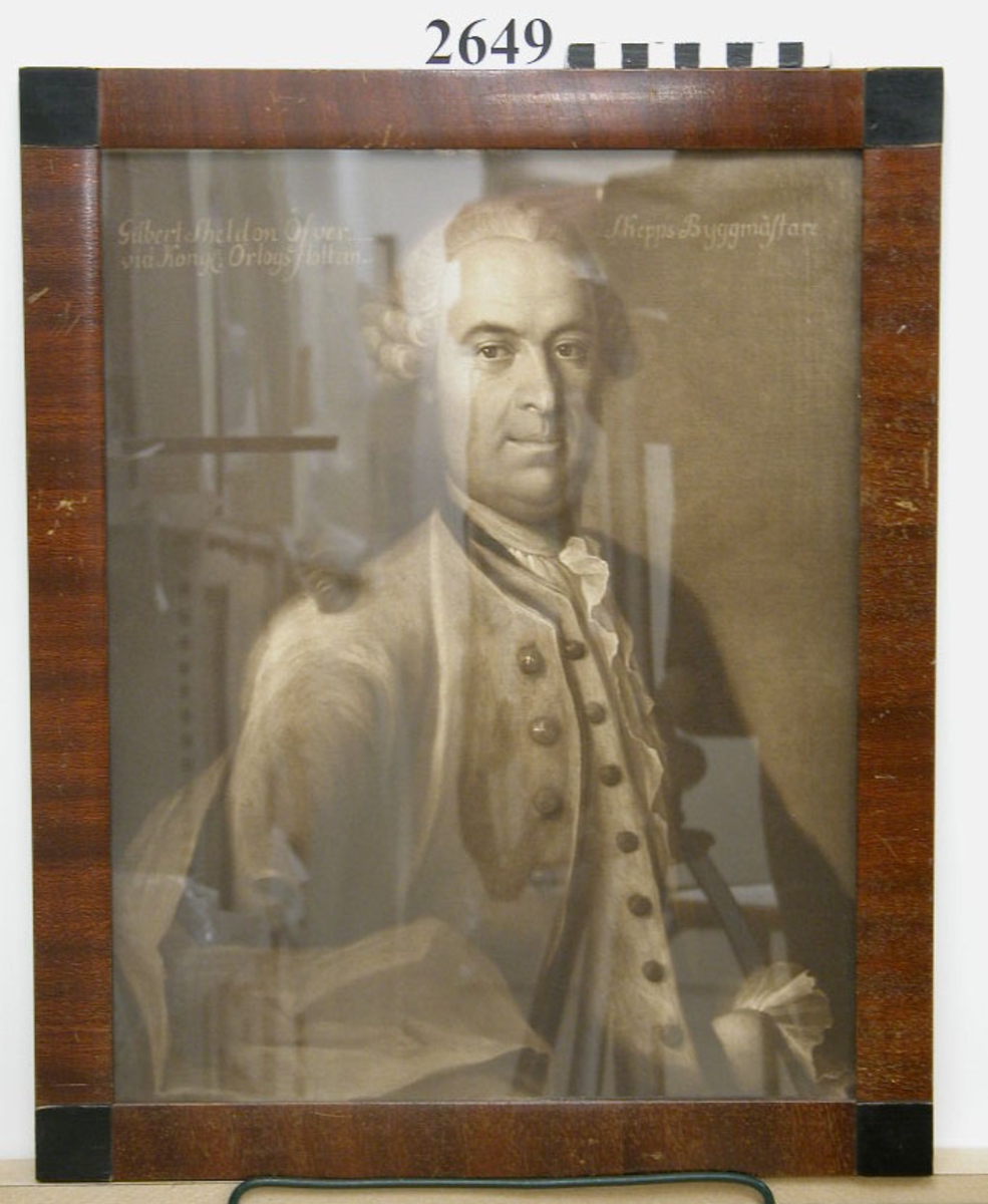Fotografi av porträtt av överskeppsbyggmästaren Gilbert Sheldon, inramad i brun ram.