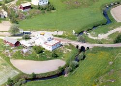 Skråfoto av kolonialforretning ved Lund på Vadtvedt i Degern