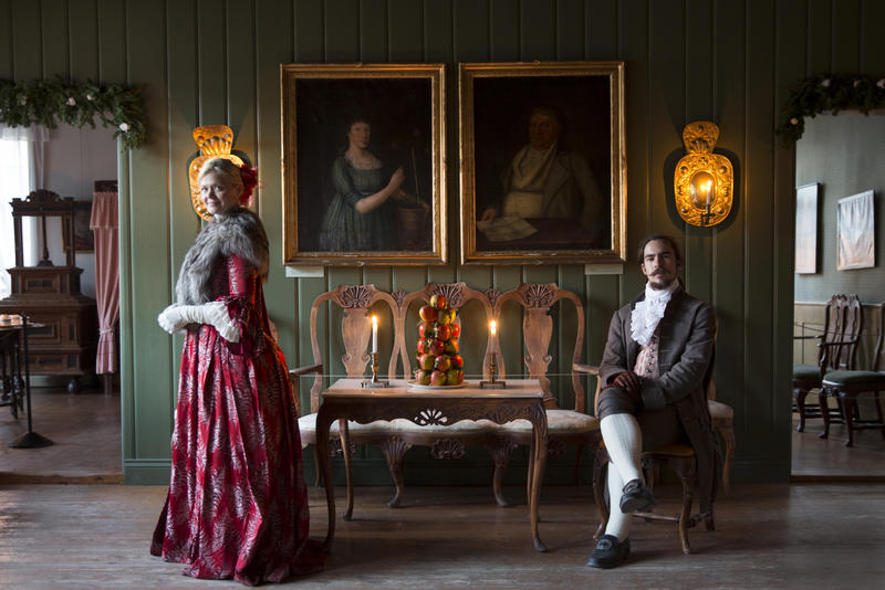 Woman and man in 1700s costumes in Chrystie