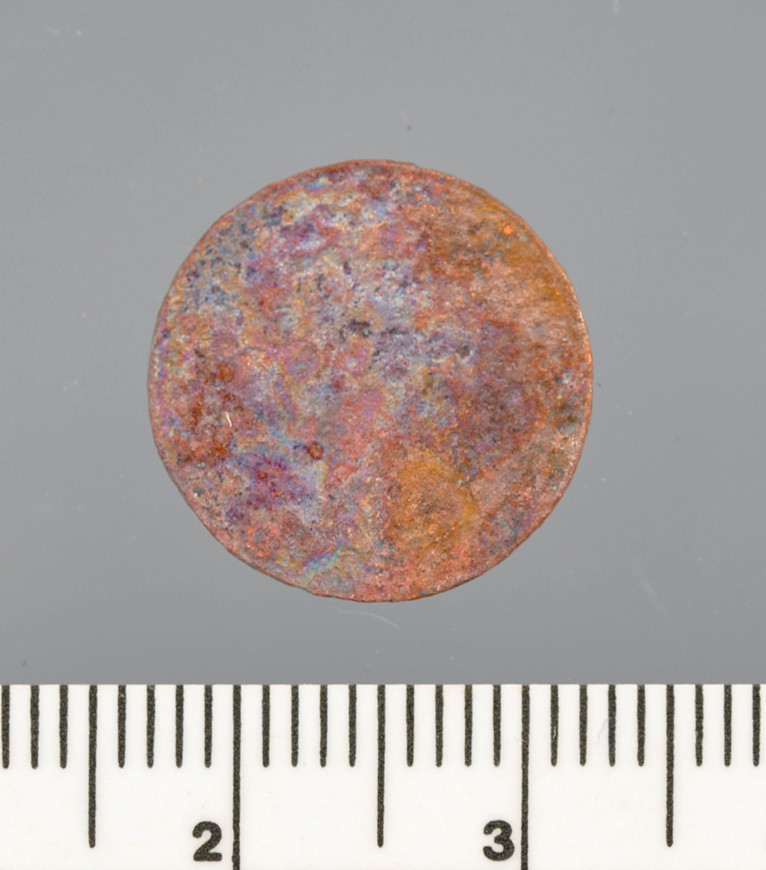 Mynt i metall, funnet i Vågen i Bergen.