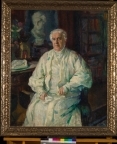 Portrettmaleri av Karoline Bjørnson. Karoline sitter ved et skrivebord som er antatt til å være på Aulestad.