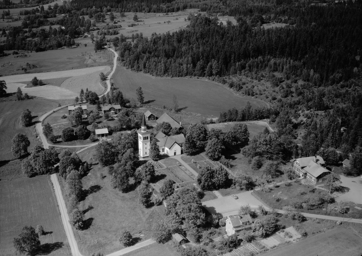 Flygfoto över Marbäck och Marbäcks kyrka i Aneby kommun, Jönköpings län. 796/1964