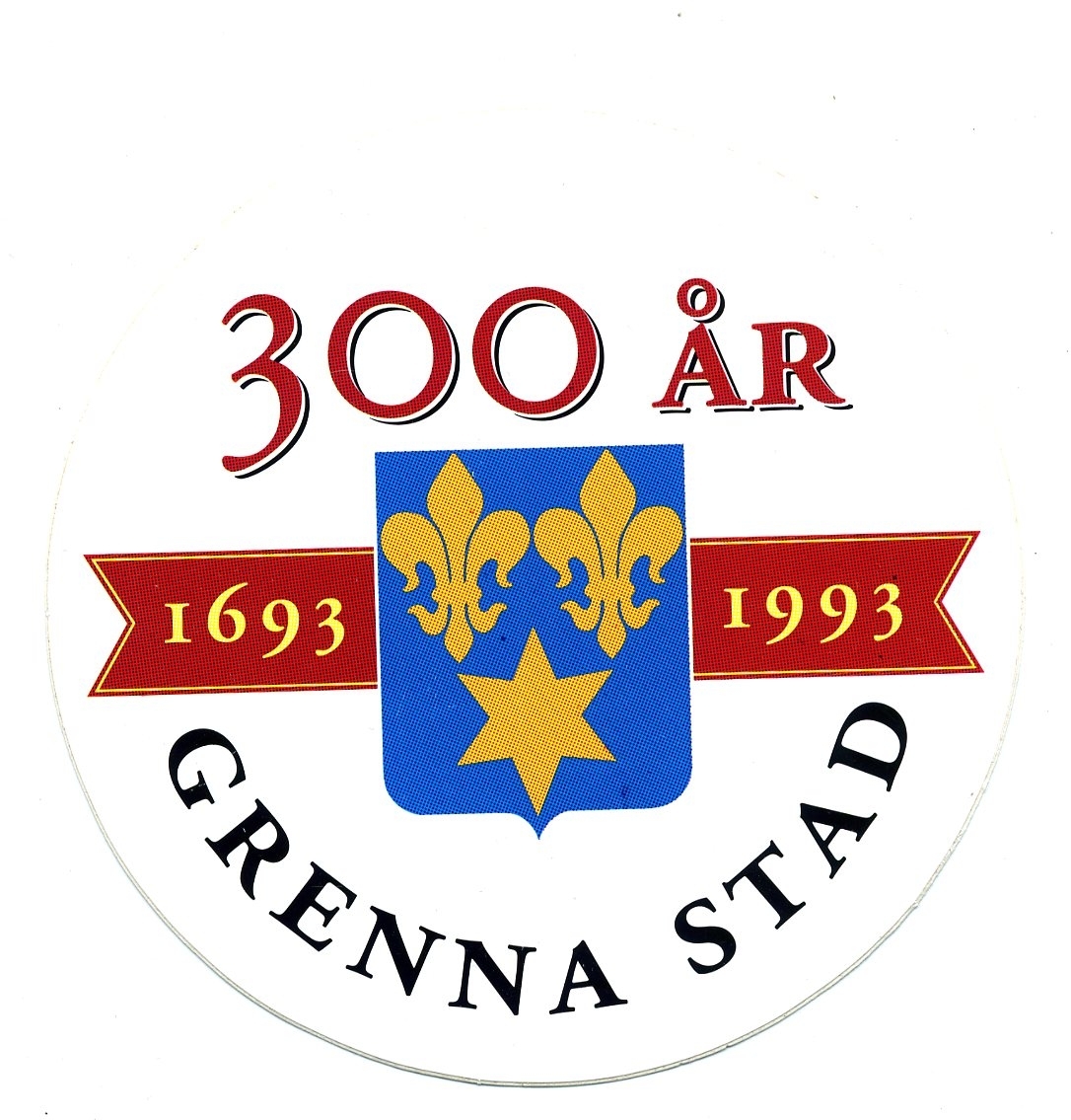 Rund plastdekal med Gränna stadsvapen och texten: "300 år 1693-1993 Grenna stad"