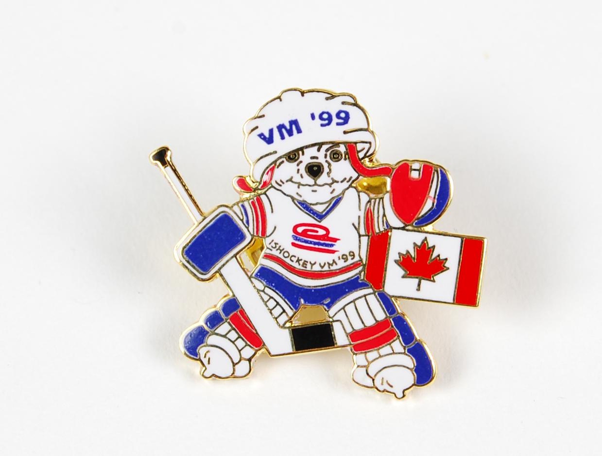 Pinsen er formet som maskoten i VM i ishockey i 1999, og maskoten har på seg ishockeyutstyr med logo for VM i ishockey i 1999. Det er også et canadisk flagg på pinsen.