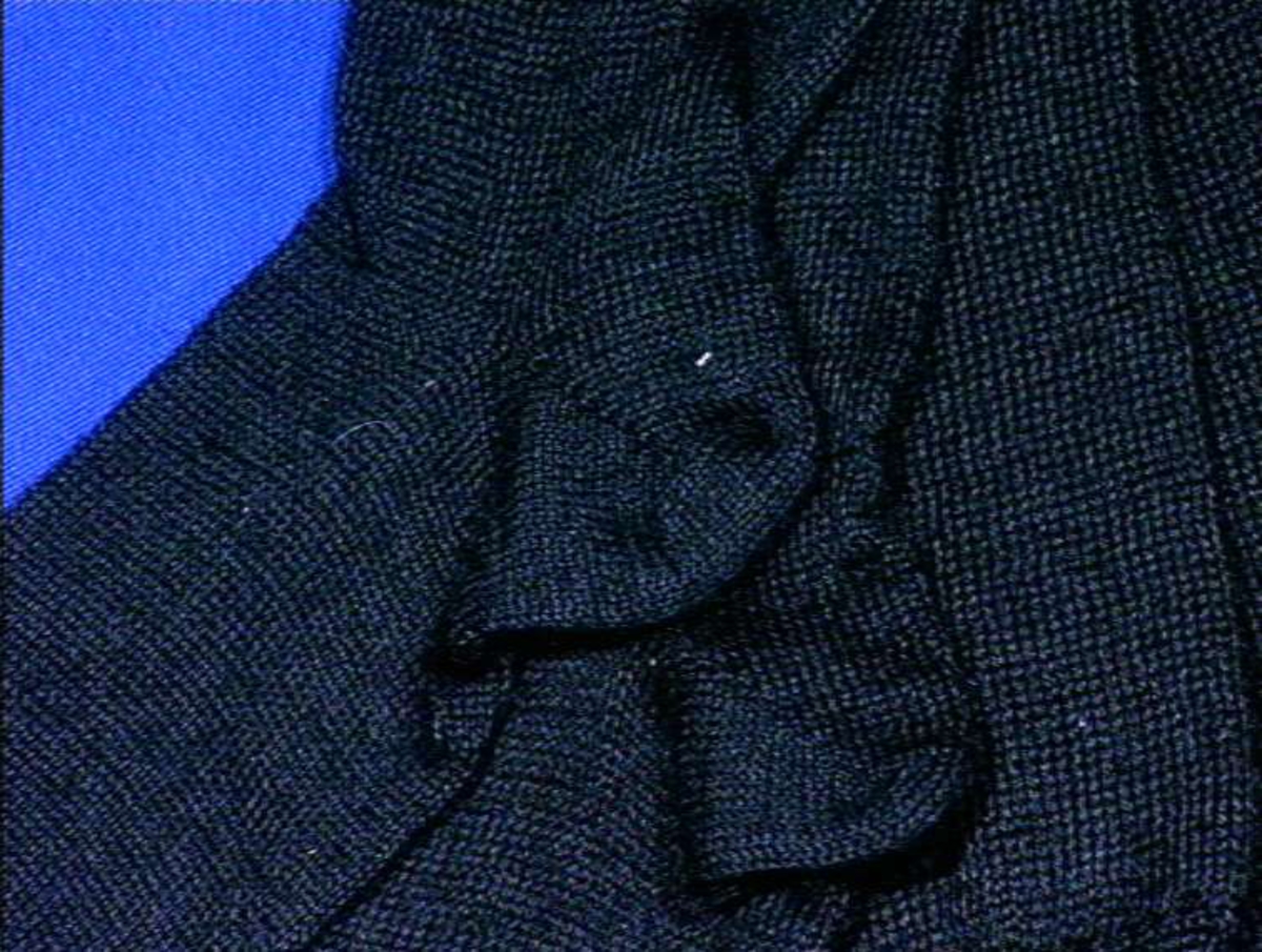Svarta strikket strømpe i ull.