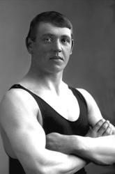 Portrett, mann i singlet, treningstrøye. Olympier og bryter 